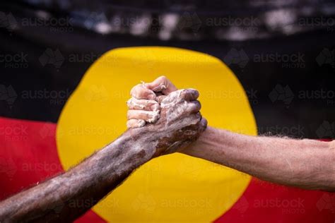 People shaking hands in reconciliation